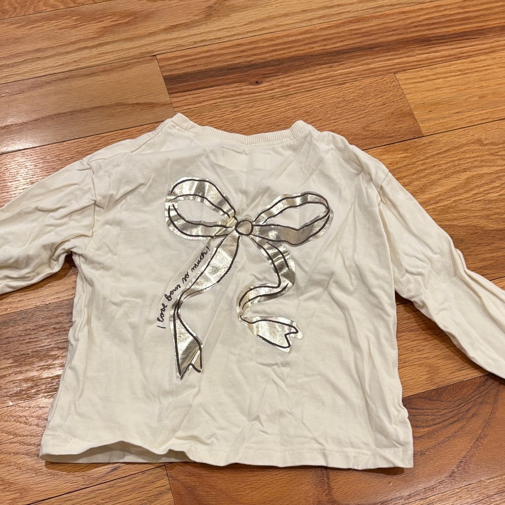 Zara White Long Sleeve Top with Silver Bow Graphic